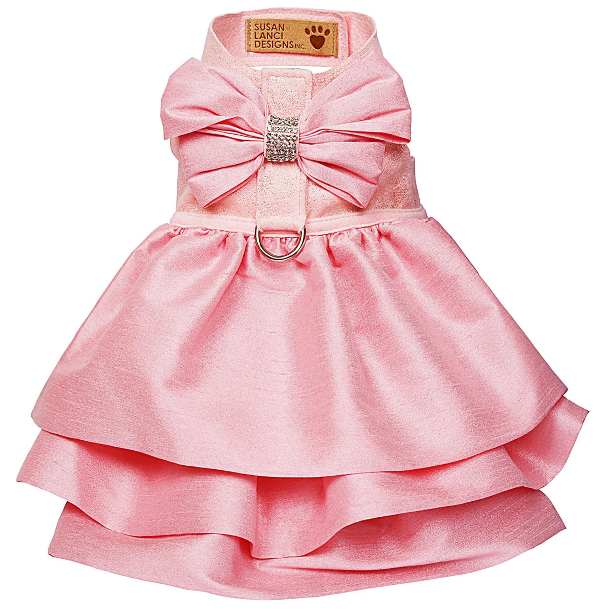 Pink dog dress with a large bow on a white background