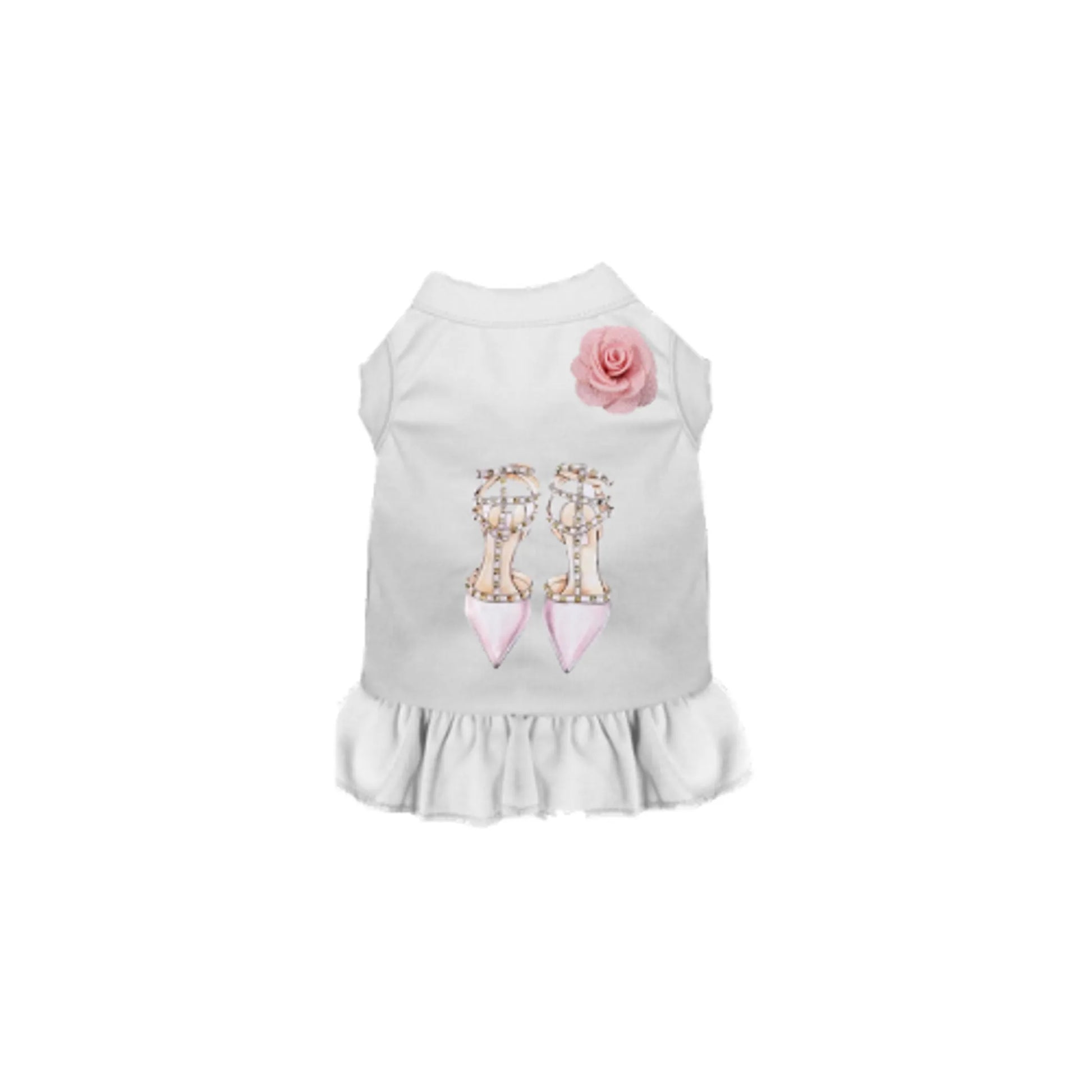 White loubarkin dress with pink pointy heals and pink flowet