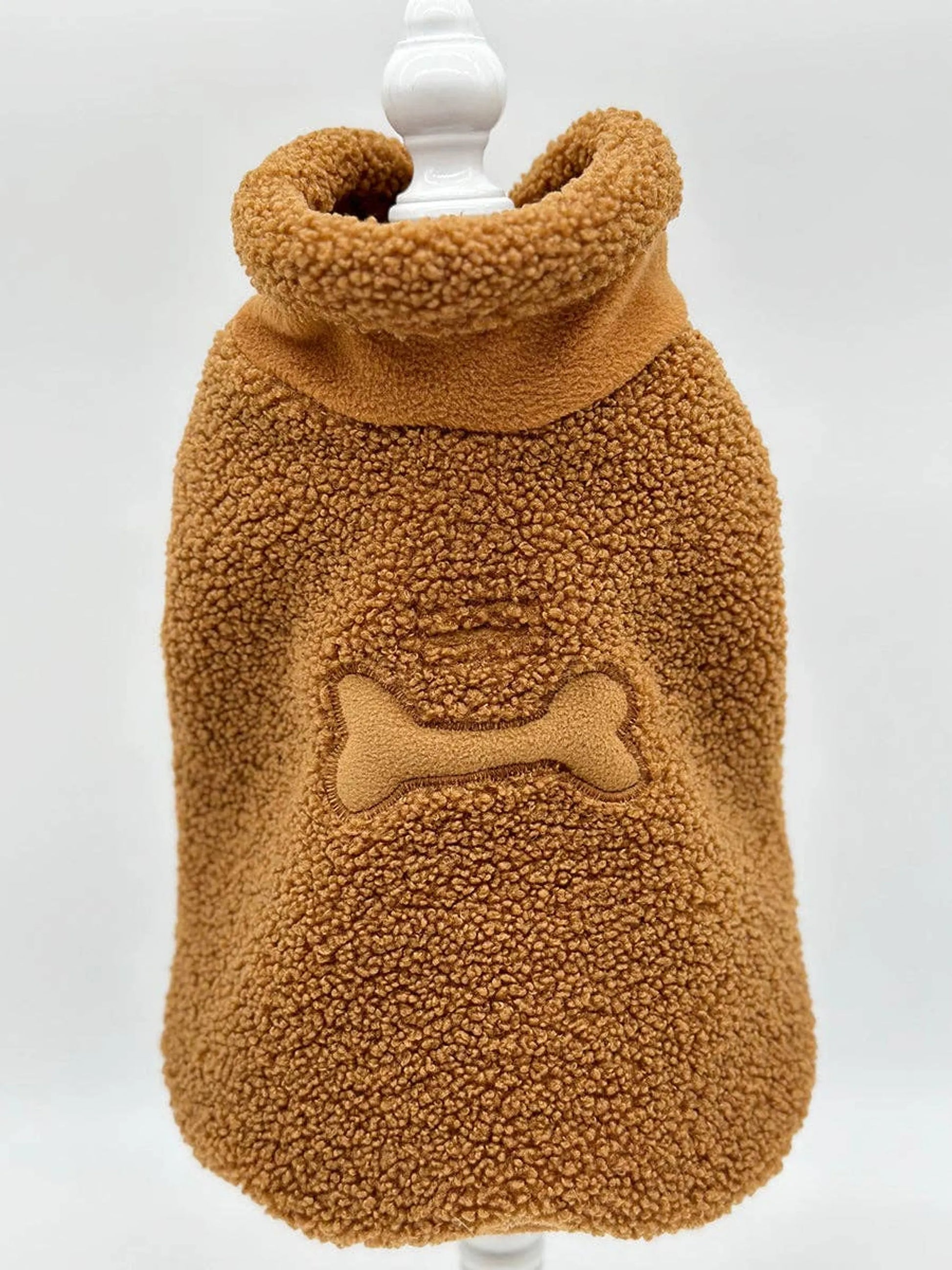 Brown sherpa dog coat on stand