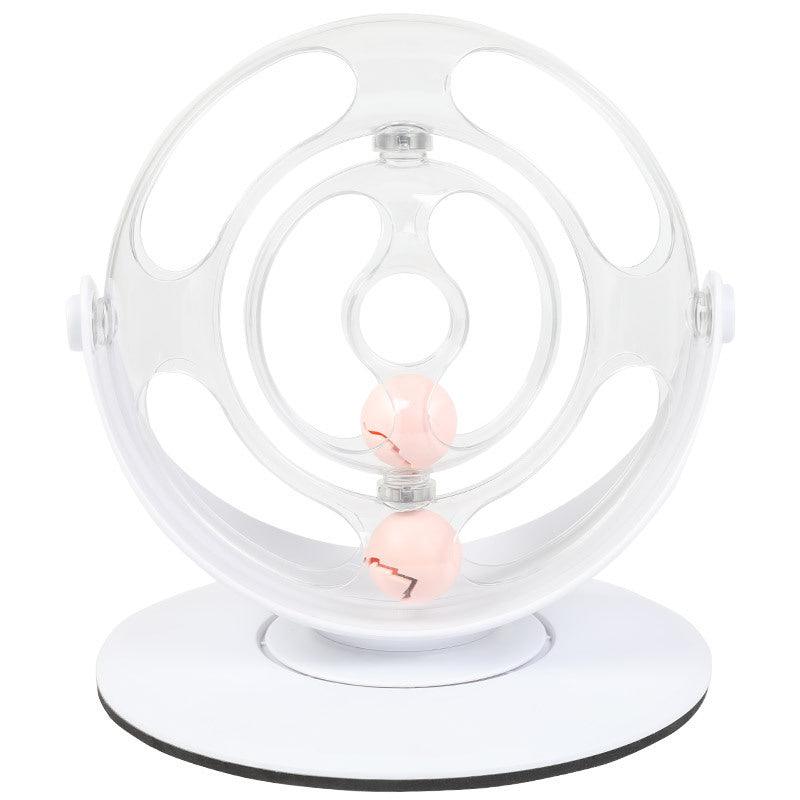 Clear spherical pet toy with pink balls on a white background