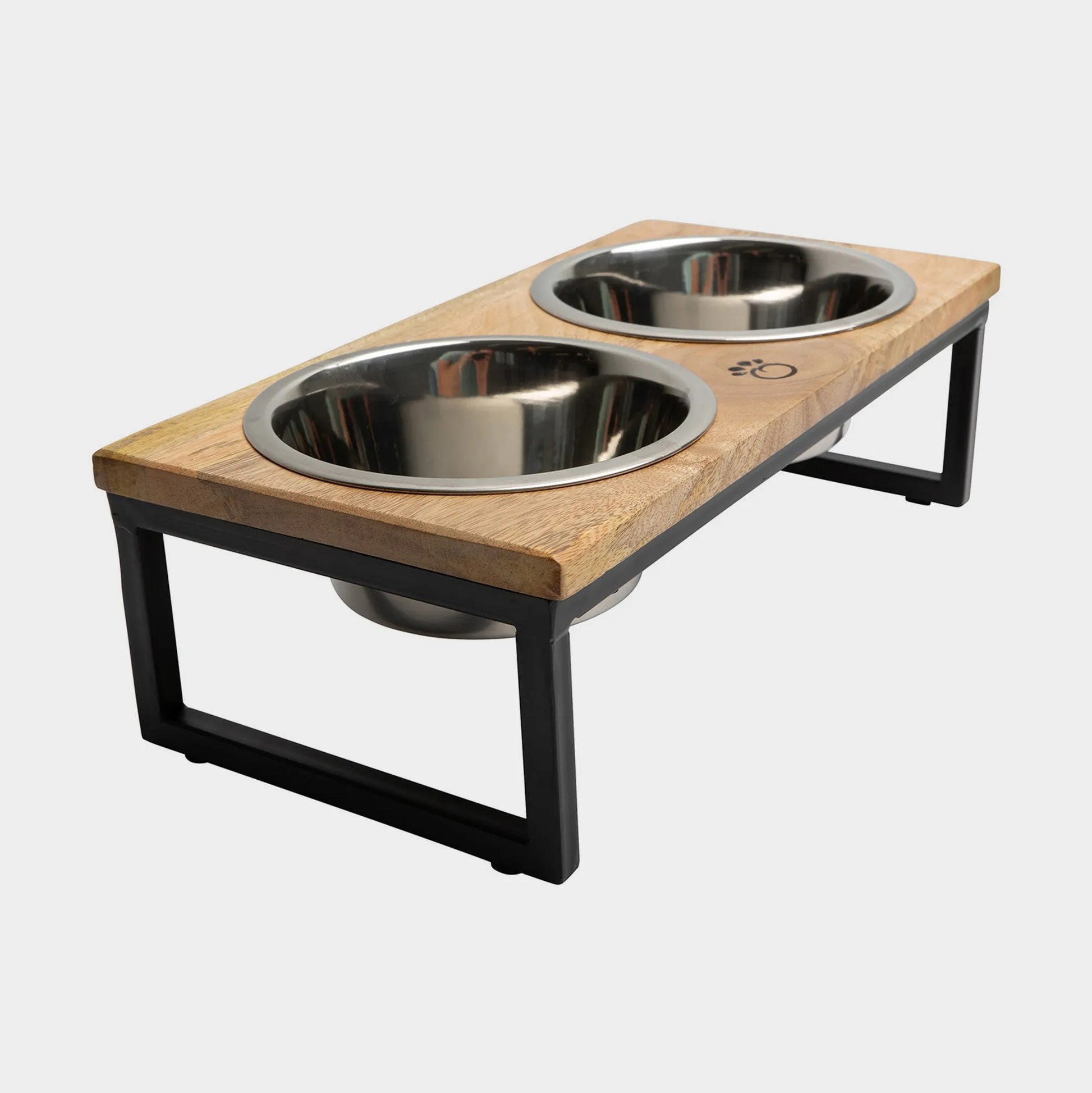 Wooden pet feeder with two stainless steel bowls on a white background