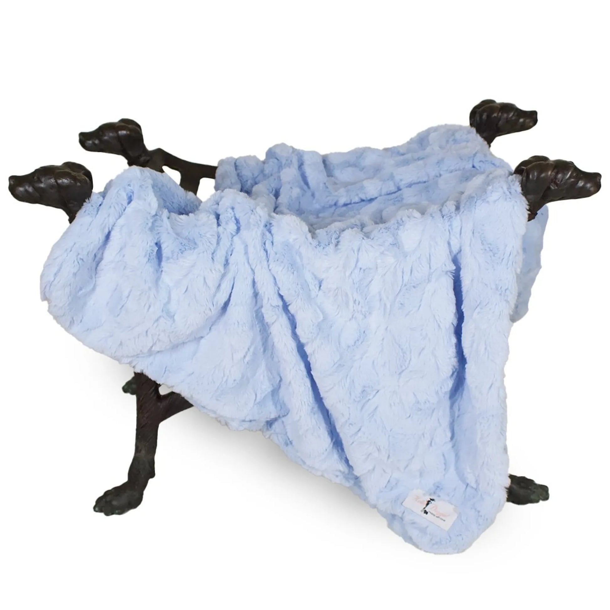 Blue blanket draped over a black metal coat rack on a white background