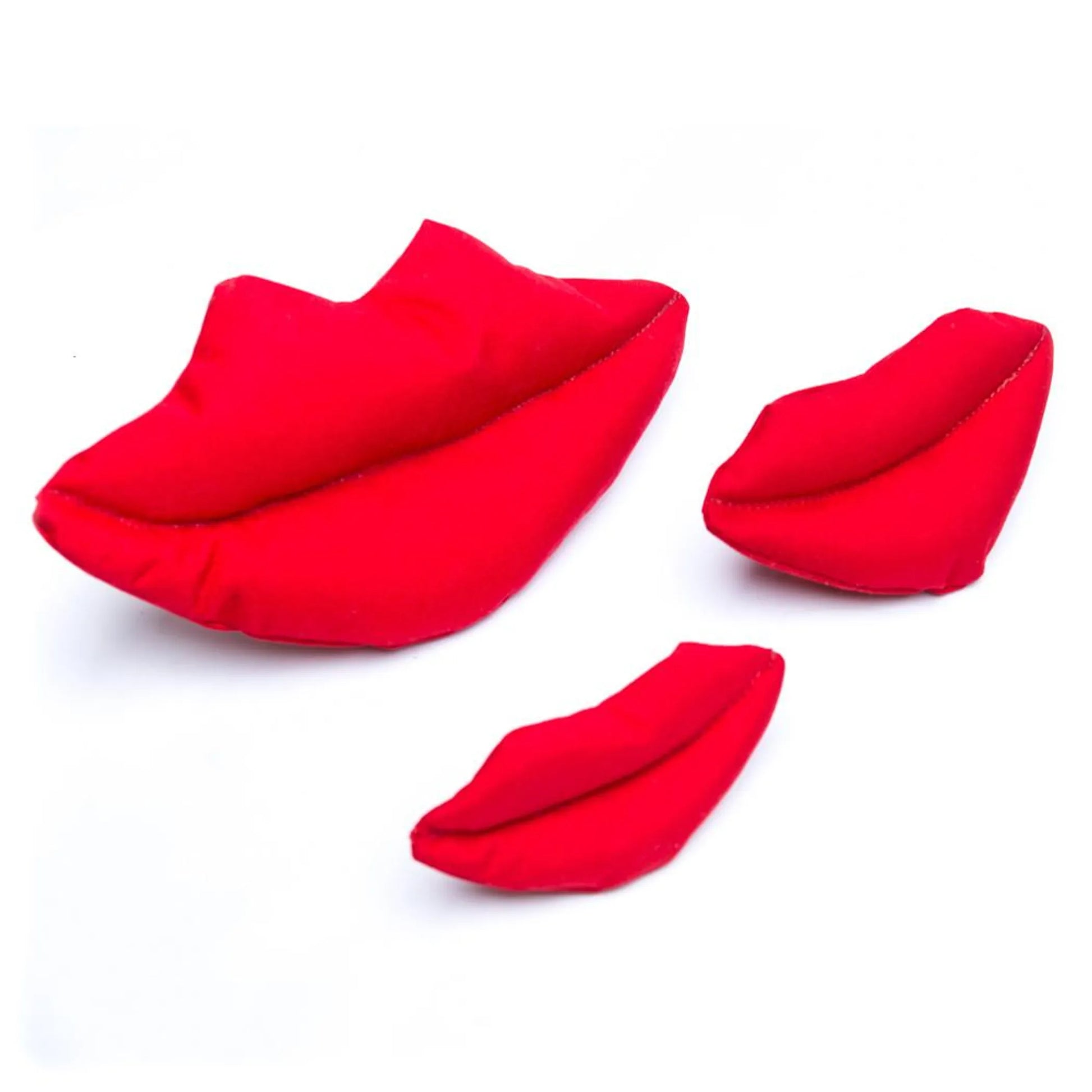 Three red fabric lip dog toy on a white background