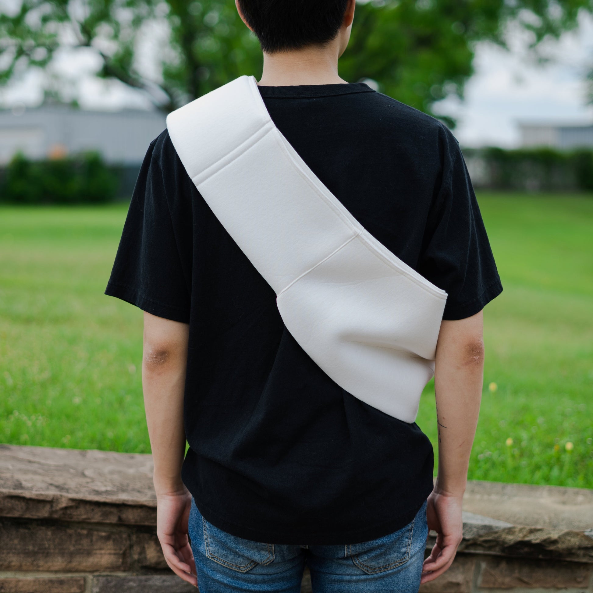 back view of person wearing sling