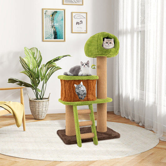 Cat tree with multiple cats in a room with a plant and framed pictures on the wall.