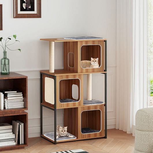 Wooden cat tree with multiple levels and a cat sitting on top in a room with books and a plant.