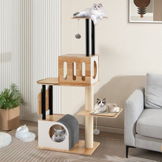 Cat tree with multiple levels and a cat sitting on top in a living room setting.