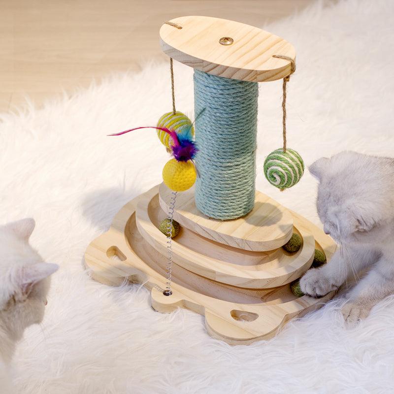Cat toy with scratching post and hanging toys on a fluffy surface