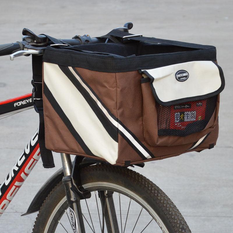 Brown and beige bicycle bag attached to a bike with a blurred background